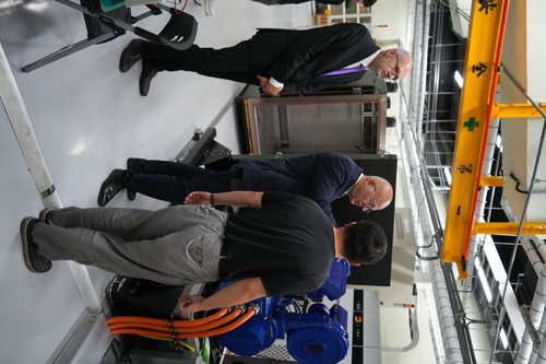 Engineer showcasing the laboratory equipment to the President and Vice President of RWU.(Open new window/jpg file)Image